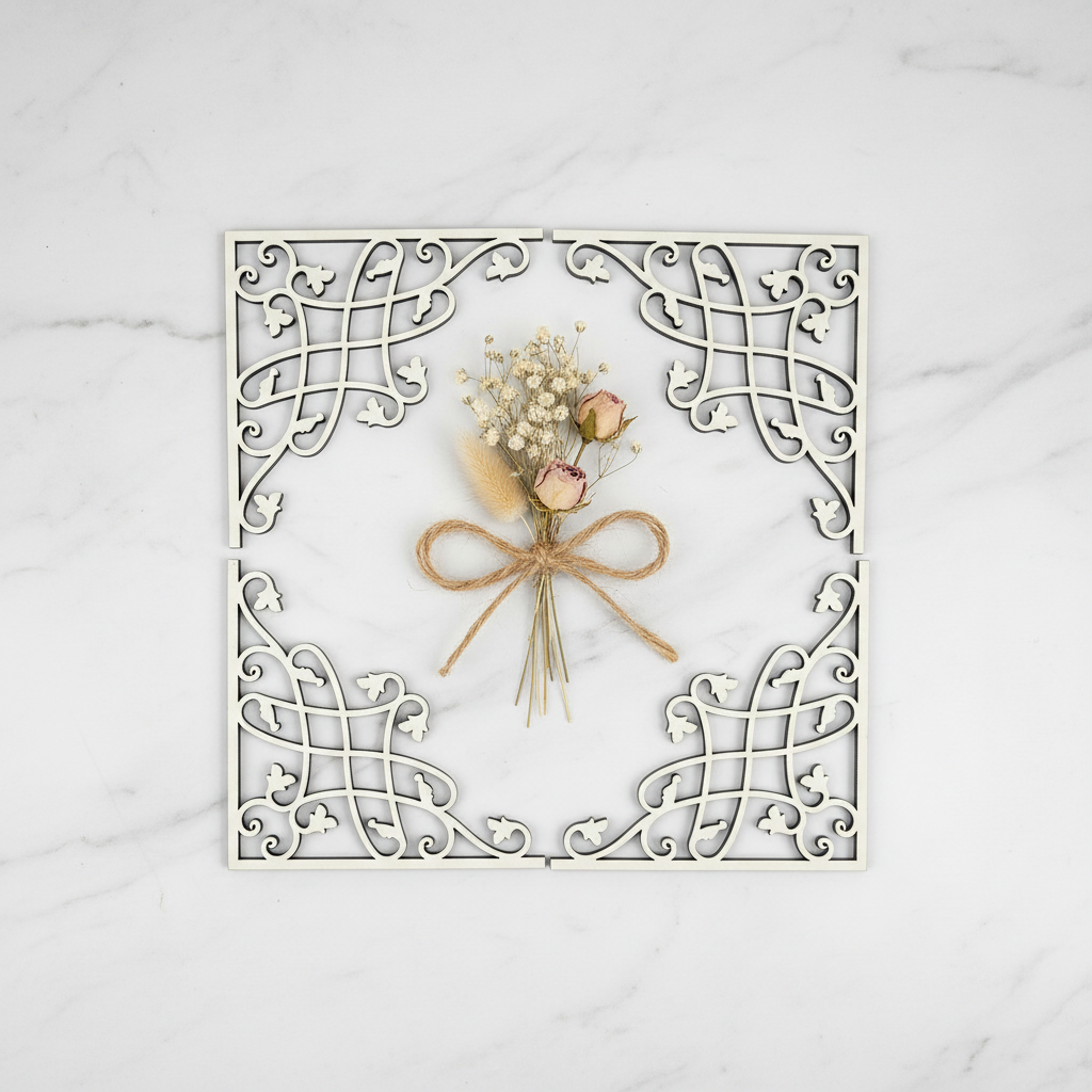 Set de cuatro Esquineras Rukn blancas presentadas como regalo premium en flat lay sobre mármol blanco
